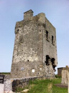 Rathlee signal tower viewed from the grass showing the bartizan at the corner