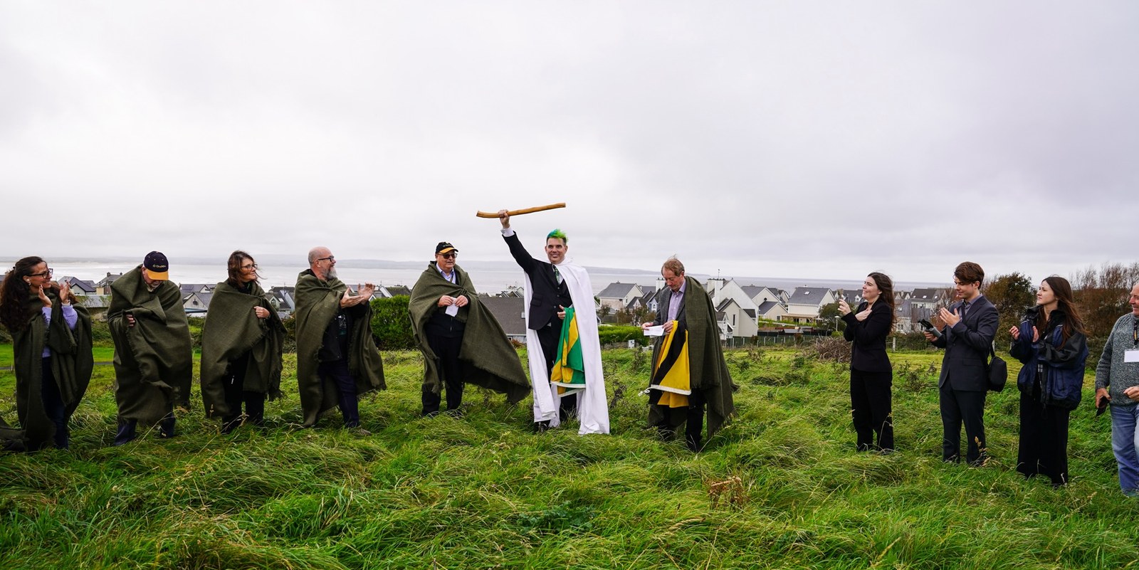 Sean O'Dowda Stephens raises the White Wand on the inauguration mound at Enniscrone, 9 October 2025