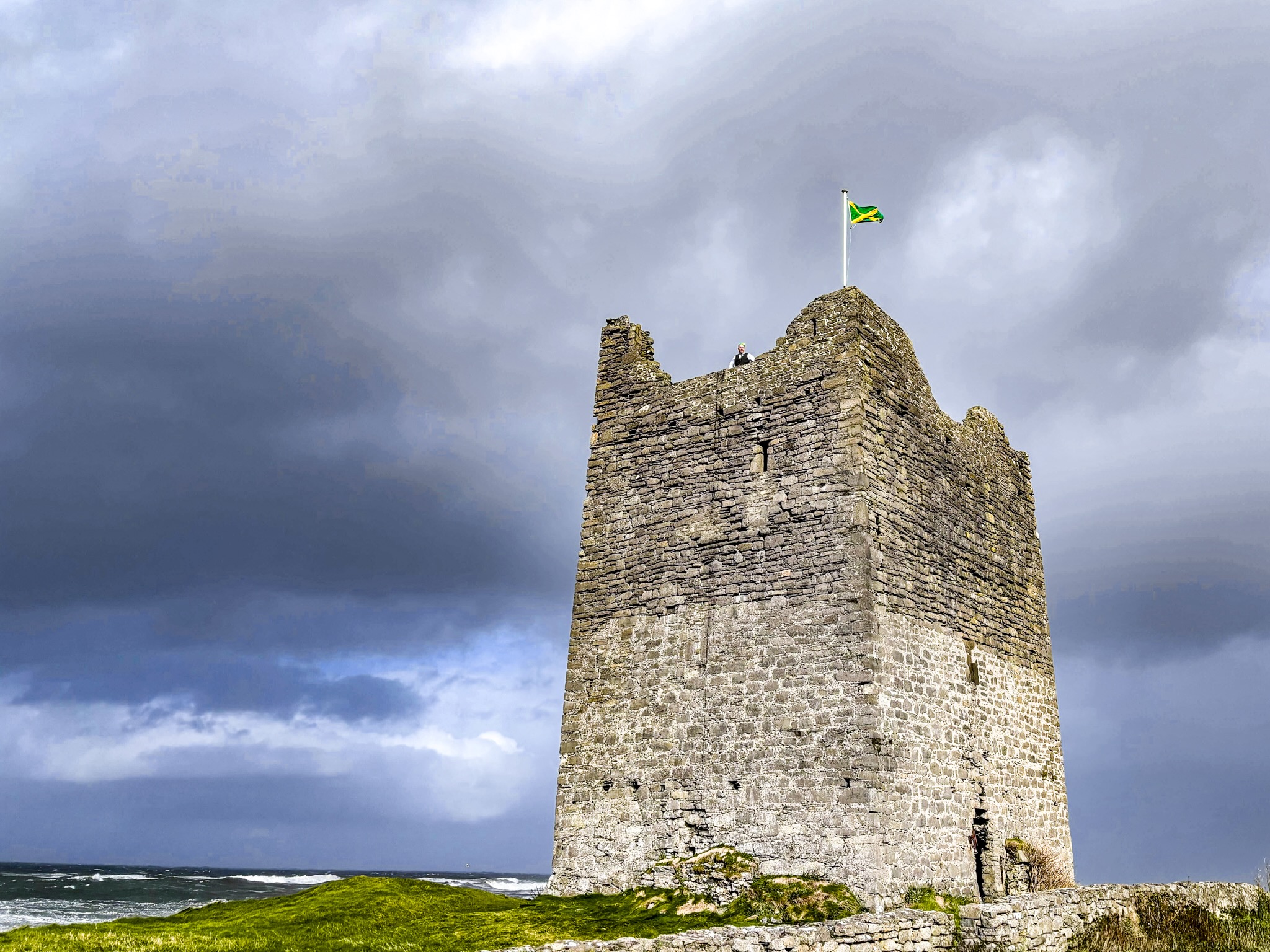 Roslee Castle, Easkey, County Sligo — tower viewed from the seaward side against a stormy sky