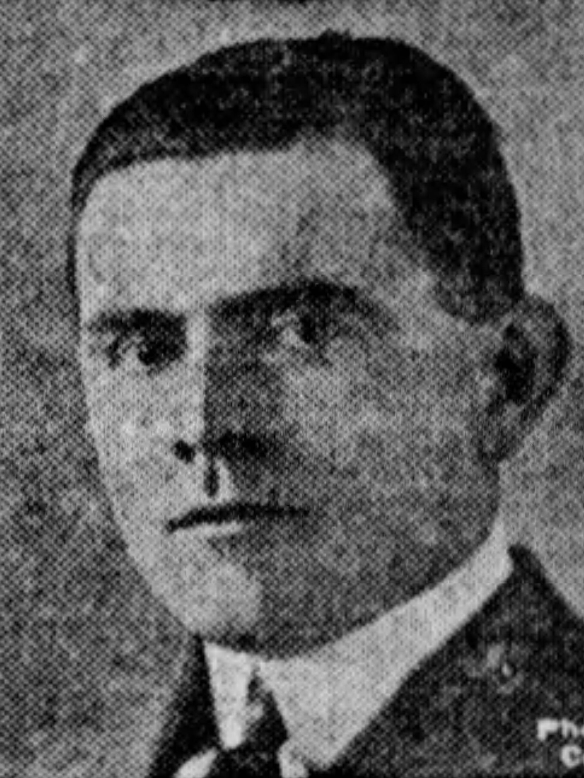 Portrait of John F. Dowd, circa 1925, a young Boston politician in dark suit and tie